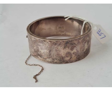 A wide silver bangle 