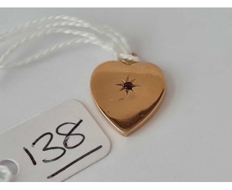 A Victorian gold heart pendant with central ruby – 1.4 gms