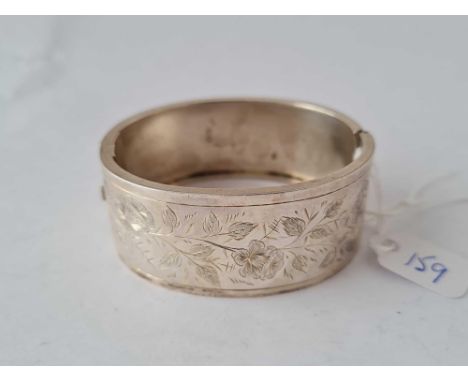 A wide silver bangle – 30 gms 
