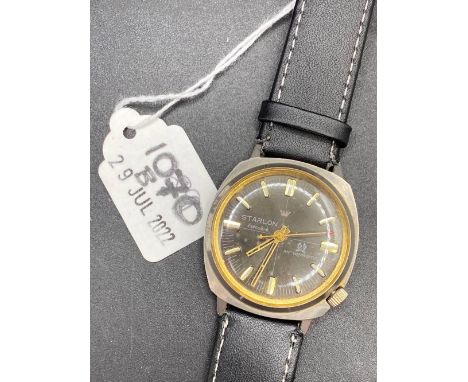 A gents black faced STARLON wrist watch with seconds sweep W/O