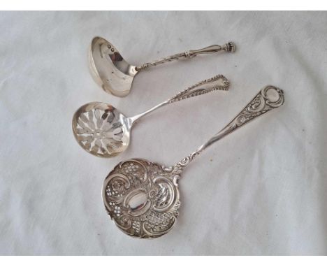 Two decorative sifter spoons and a small ladle