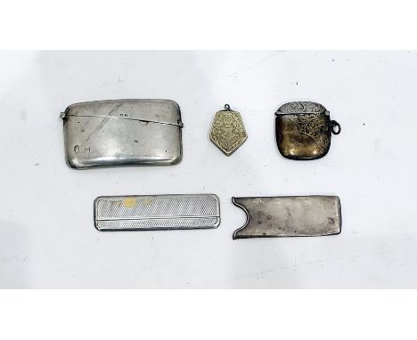 Silver visiting card case, Birmingham 1920 of plain curved rectangular form, a silver-cased comb with engine-turned decoratio