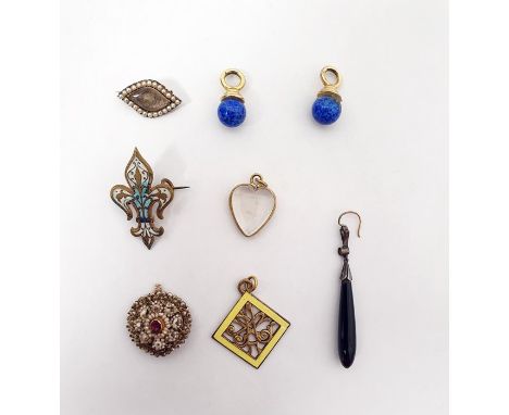 19th century memorial brooch of shaped oval form, the glazed compartment surrounded by border of seedpearls, a gilt metal hea
