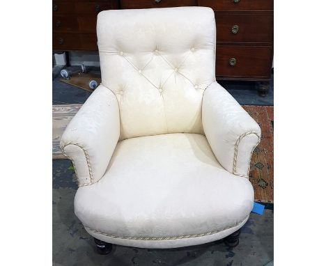 Pair of 19th century armchairs in cream button back upholstery, on mahogany turned front supports to brown china castors, the