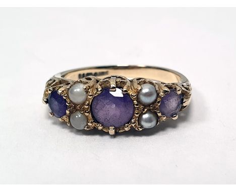 9ct gold, amethyst and seedpearl ring, the three circular mix cut amethysts with seedpearl points, finger size N