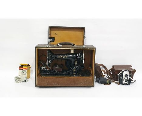 Electric Singer sewing machine, a W.Ottway & Co Ltd of Ealing monoscope in brown leather case and a Brownie Reflex 20 camera 