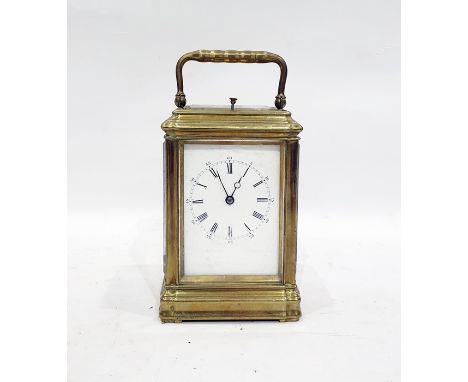 French brass striking carriage clock, with Roman numerals to the dial