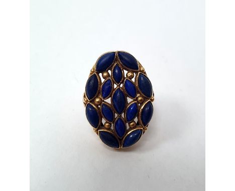 Gold cluster ring set with lapis lazuli (possibly Indian), the shoulders set with rubies (one missing) and with foliate decor