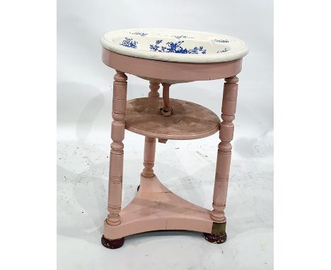 Porcelain wash basin on a pink painted stand, the circular middle tier united by turned supports, on a triform base to squat 