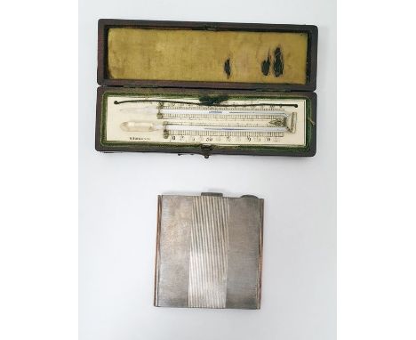 Silver compact by Harrods Limited, London 1939, of square engine-turned form with integral mirror and in fitted Harrods case 