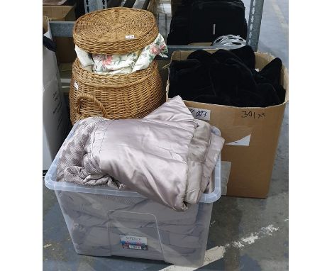 Pair of bed quilts, various curtains and a wicker laundry basket 