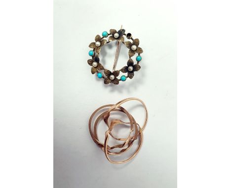 Gold four-piece puzzle ring, unmarked and a brooch of circular flowerhead form set with cultured pearls and blue paste (one m