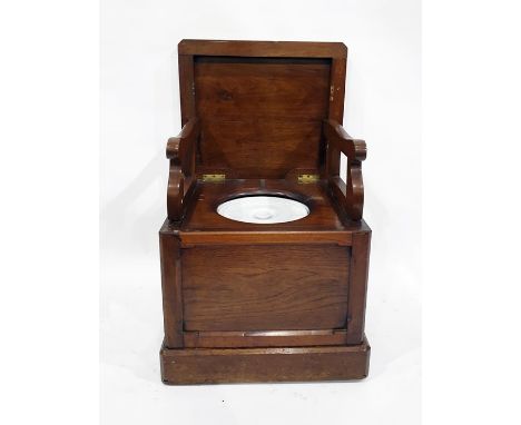 19th century mahogany commode, the top with canted corners and moulded edge, raising to reveal folding armrests, porcelain po