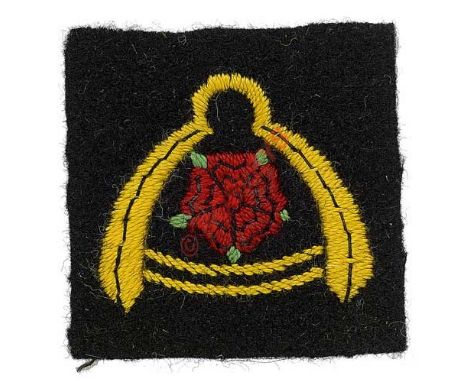 Badge. P Battery, 524th Light AA/SL Regt. Royal Artillery cloth formation sign. Dark blue rectangle embroidered with red rose