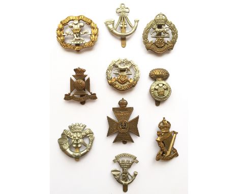 10 Infantry cap badges. S. Lancs (numbered) ... Ox & Bucks ... R, Hampshires ... Wiltshire ...  Hampshire ...  RWF ... DCLI .