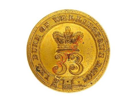 33rd Regiment of Foot Victorian Officer’s gilt closed back coatee button. Crowned “33” within strap inscribed “The Duke of We