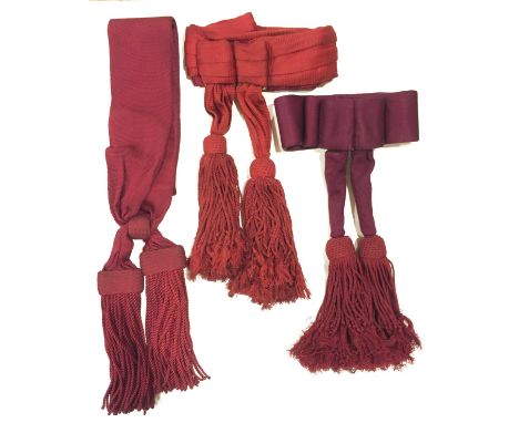 Three Infantry Officers’ Sashes. All crimson silk. One shoulder-sash with flat woven heads to tassels. A waist-sash of the pl