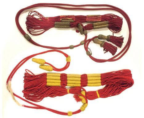 Two Hussar Barrel Sashes. Rare examples. An officer’s barrel sash of crimson silk cord with five gold worked sliders and fini