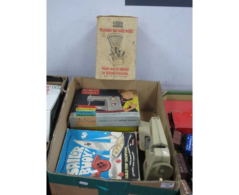 Juvenalia - Four children's toys including a boxed Vulcan Classic child's electronic sewing machine, Mettoy Playthings Playsc