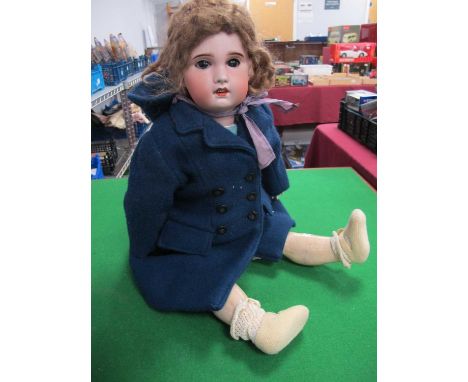 An S.8.B.J Doll, curly hair, blue overcoat, hands complete, overall fair condition.height 64cm high, no obvious cracks/chips 