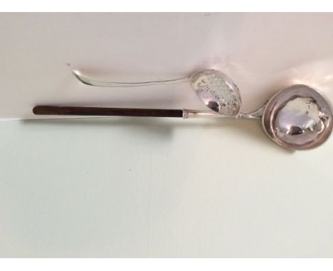 An 18th c silver toddy ladle and a fretted sifter spoon
