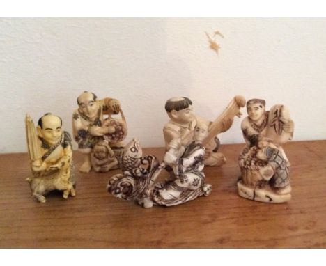 Four Japanese ivory netsuke and one okimono