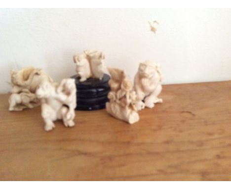 Three 20th c ivory okimono and two netsuke inc. a monkey with a baby