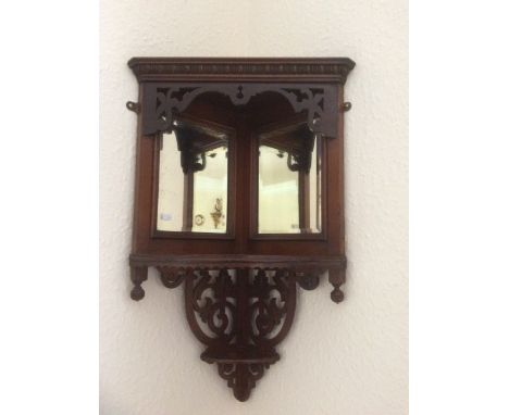 Edwardian mahogany corner shelf with bevelled glass mirror