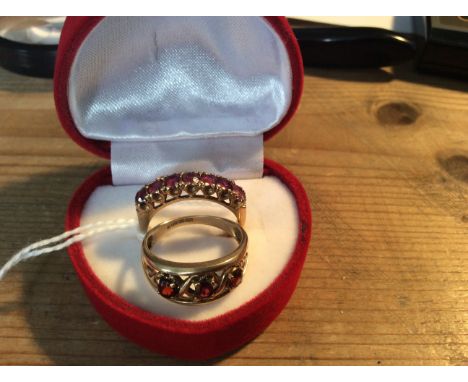 A 9ct gold and garnet dress ring O/P and another similar