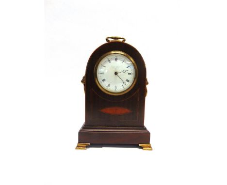AN EDWARDIAN INLAID MAHOGANY MANTLE CLOCK  with lion mask brass handles to the sides, the enamel dial with Roman hours and Ar