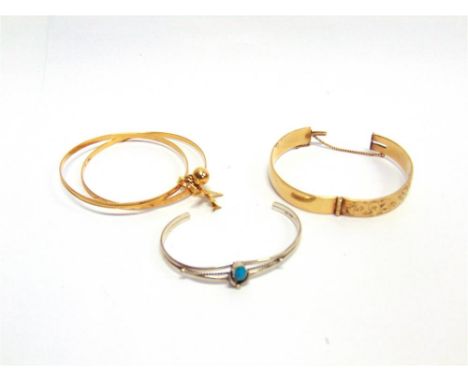 A PAIR OF BANGLES stamped 720, Persian, joined by a baton with a sphere and plane charm attached, 16g gross; a turquoise Narr