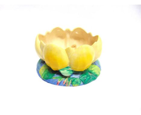 A CLARICE CLIFF NEWPORT POTTERY PLANTER , modelled as a waterlily, green printed mark to base, 22.5cm long 17.5cm wide 12cm h