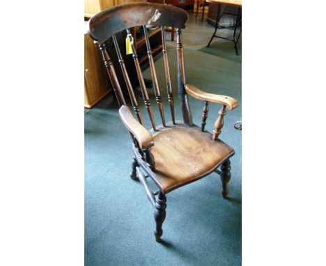 A COMB BACK WINDSOR ARMCHAIR on double H-shaped stretcher base, 112cm high overall, the seat 48.5cm wide 47.5cm deep