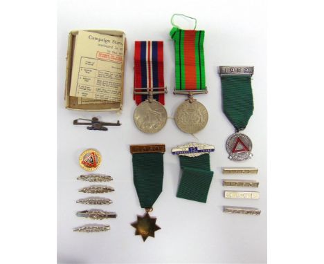 A SECOND WORLD WAR PAIR OF MEDALS ATTRIBUTED TO PRIVATE W.H. SAUNDERS, ROYAL ARTILLERY comprising Defence Medal and War Medal