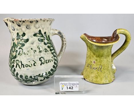 Ewenny Pottery milk jug marked Jones Bridgend, inscribed 'Gwell Clwt na Thwll' together with another Ewenny Pottery water jug
