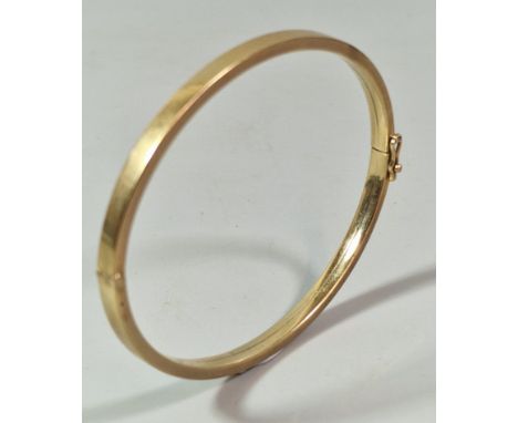 9ct gold bangle of plain form. 7.7g approx. (B.P. 21% + VAT)