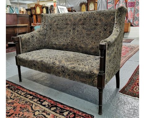Edwardian mahogany wing back two seater parlour sofa, having floral and foliate upholstery, turned and shaped arms on spiral 