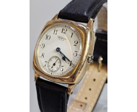 9ct gold mid century Waltham cushion shaped gentleman's wristwatch, with white enamel Arabic face, having seconds dial, on as