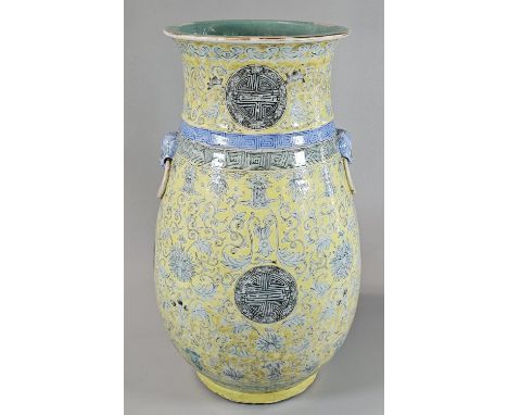Chinese porcelain vase, of baluster form all over decorated with scrolling floral designs in green enamel with four Shou char