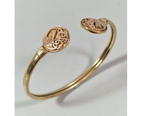 9ct Clogau yellow and rose gold dragon torque bangle. 14.6g approx. (B.P. 21% + VAT)