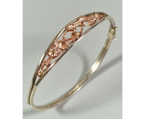 Clogau gold, a silver and rose gold Tree of Life design bangle. 11.5g approx. In original box. (B.P. 21% + VAT)