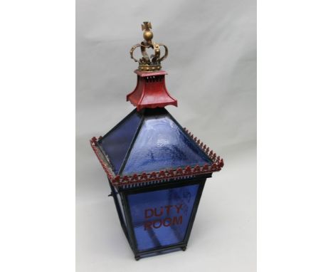A late 19th century cast iron and glass Military Police Lantern, with crowned finial over tapering four panelled top, over ta