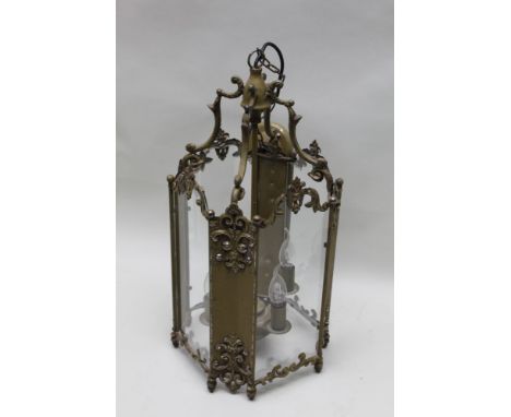 A first quarter 20th century believed French antique design metal and glass hanging hall lantern, four sconce centre, 62cm hi