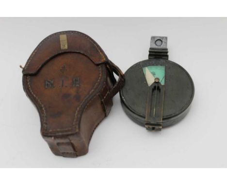 A leather cased military pocket compass 