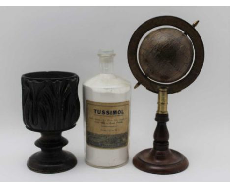 A desk top terrestrial globe on turned mahogany stem &amp; base, 25cm high, together with a carved oak goblet form vessel, 15