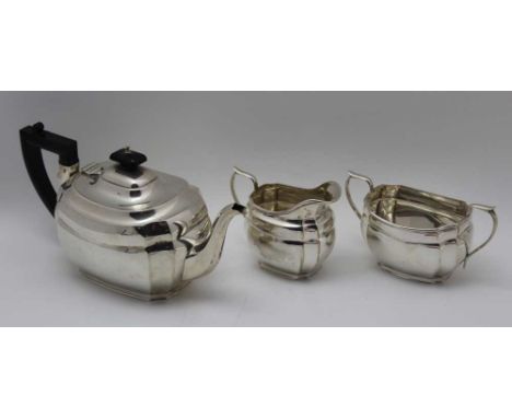 S. Blackensee &amp; Son Ltd. A 20th century silver three piece tea set of Georgian design, comprising; teapot, milk jug, and 