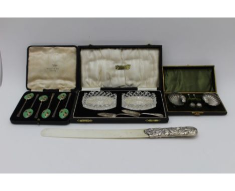 A Victorian silver handled page turner, a cased Walker & Hall silver & enamel set of six coffee spoons, Birmingham 1937, a ca