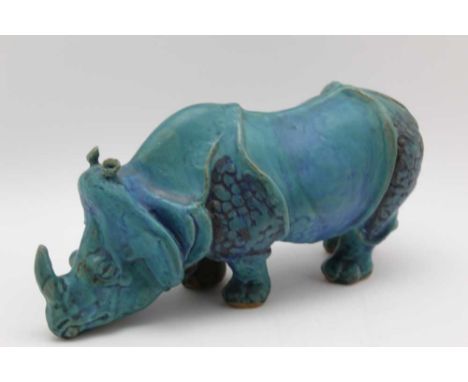 A 20th century earthenware model of a rhinoceros, blue / green glaze, 12cm highCondition report: Good condition, no chips or 
