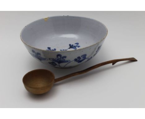 A 19th century tin glazed earthenware bowl, with cobalt blue floral decoration, 21cm in diameter, together with a 19th centur