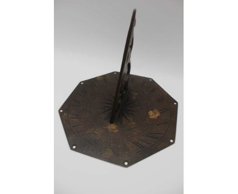 A first quarter 20th century sundial of typical form and construction, bearing the name Silas Higgdon, 25.5cm in diameter 